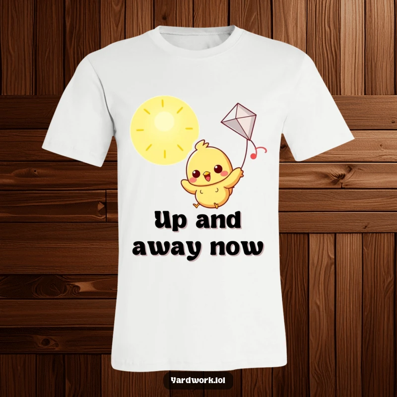 Funny t-shirt featuring a cheerful chick flying a kite high in a bright, sunny sky.